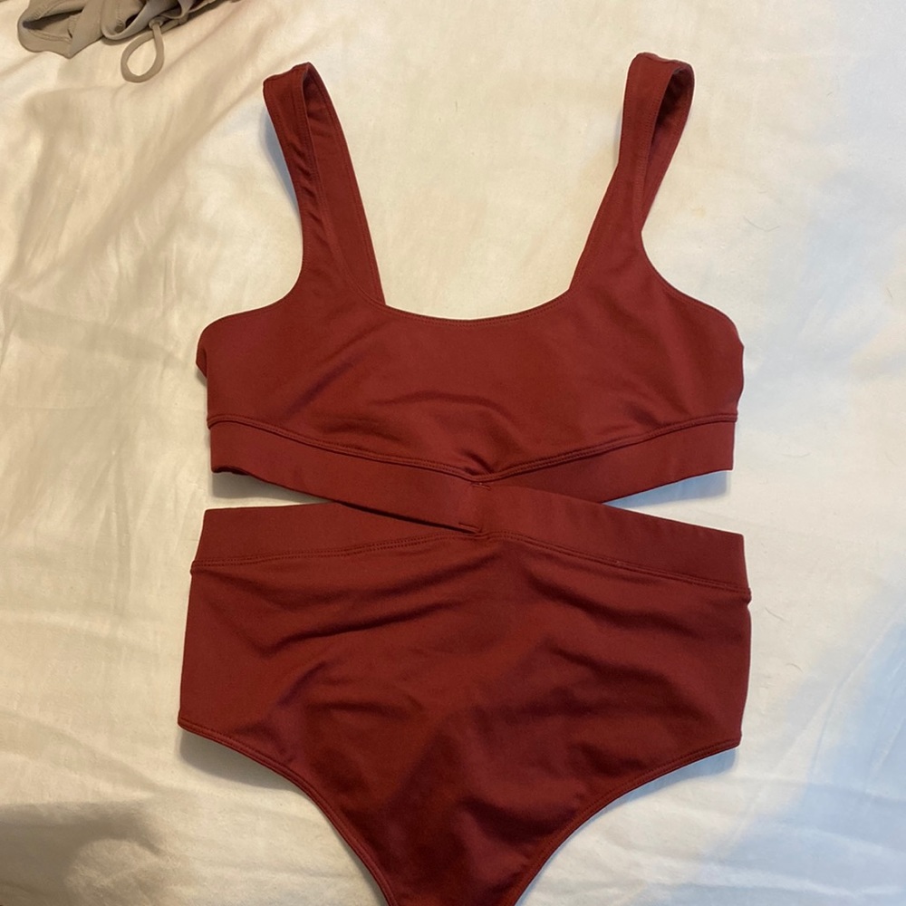 FP Movement NWOT bodysuit with cut-outs and criss-cross waist detail